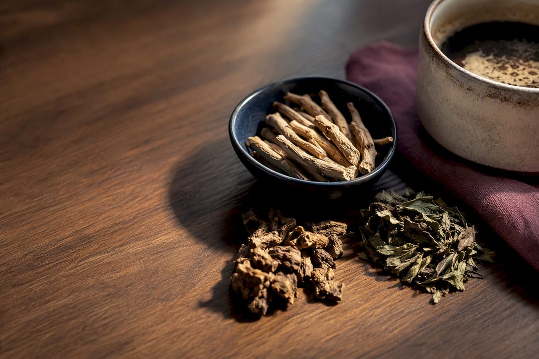 Adaptogen botanicals beside morning coffee