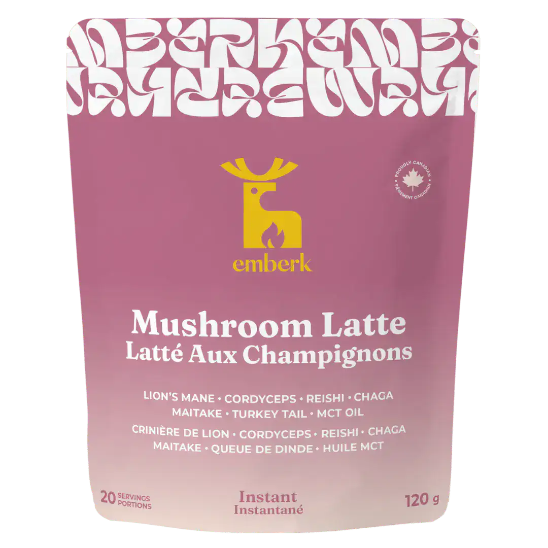 A 120 g pouch of Emberk Mushroom Latte on a plain white background. The packaging is a dusty rose pink with a yellow Emberk logo and white text.