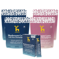 Emberk Ultimate Kit with two pouches of Mushroom Coffee, two pouches of mushroom latte, and one mushroom coffee travel pack, shown in blue and pink packaging on a white background