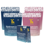 Emberk Ultimate Kit with two pouches of Mushroom Coffee, two pouches of mushroom latte, and one mushroom coffee travel pack, shown in blue and pink packaging on a white background